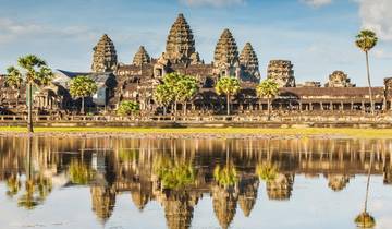 Angkor Wat temple complex with reflection in still water.