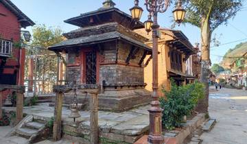 Traditional wooden building on a cobblestone street.