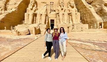 Three people posing in front of Abu Simbel temple.