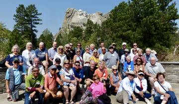 Group of tourists in front of Mount Rushmore.
