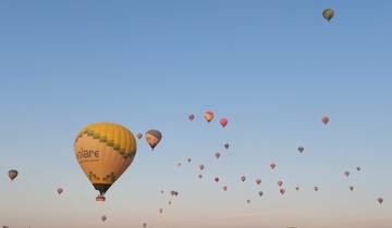 Hot air balloons in the sky at sunrise.
