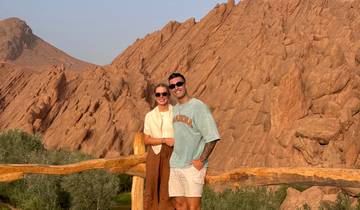 Couple posing in rocky landscape