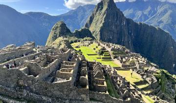 The iconic stone ruins of Machu Picchu against a backdrop of mountains.