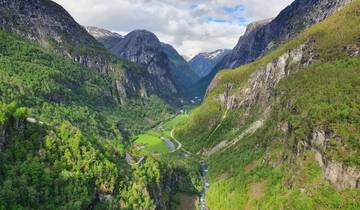 Dramatic mountain landscape with a winding river in the valley.