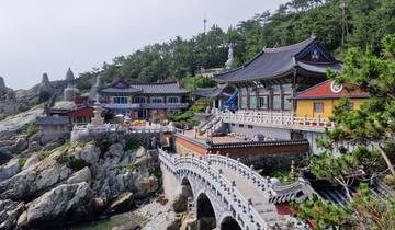 Temple on a rocky coast with intricate architecture.