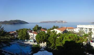 View of a coastal town with islands in the background.