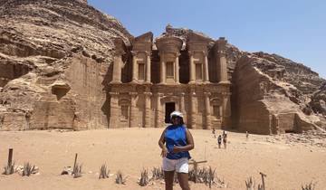 Woman posing in front of the Monastery in Petra.