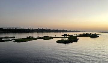 Scenic view of a river at sunset with reflections.