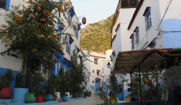Charming street with blue and white buildings in Chefchaouen.