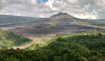 Volcanic mountain landscape with greenery.