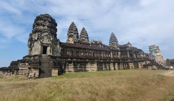 Majestic temple with ancient architecture under a blue sky.