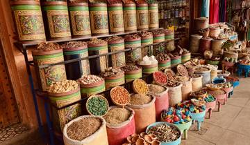 Display of spices and herbs in colorful containers.