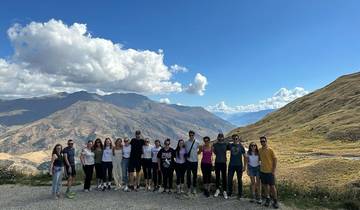 Group of people posing with mountains