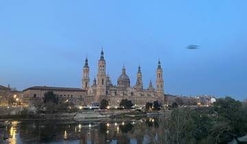 Basilica by the river at dusk.