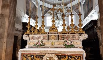 Intricately designed church altar with candlesticks