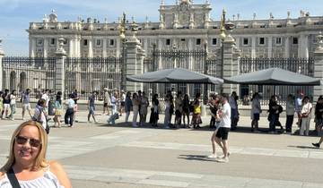 People standing outside a royal palace.