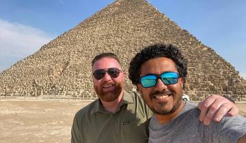 Two people posing in front of the Great Pyramid.