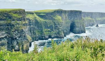 Edge of the Cliffs of Moher overlooking the sea.