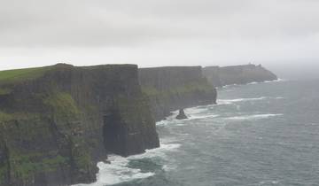 Dramatic view of the Cliffs of Moher meeting the ocean.