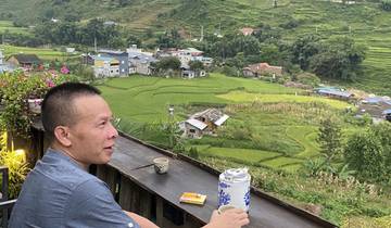 Man enjoying the view of terraces and mountains.