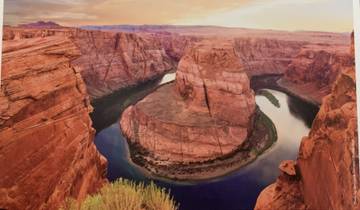 Aerial view of a meandering river in a canyon.