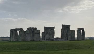The iconic Stonehenge, a circle of large standing stones in a field.