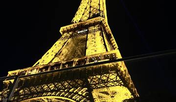 Illuminated Eiffel Tower during nighttime.