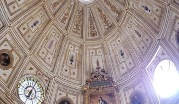 Intricately decorated dome ceiling in a church.