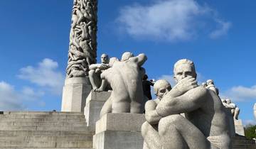 Statues in an outdoor park with a blue sky.