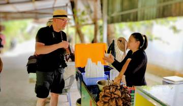 Man purchasing snack from a street vendor