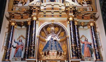Ornate altar with religious figures and intricate designs.