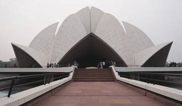 Lotus Temple with visitors on the path.