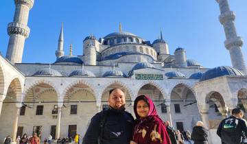 Two people posing in front of the Blue Mosque.