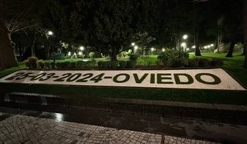 Park with a sign featuring the date and Oviedo name.