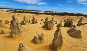 Desert landscape with rock spires under clear skies.