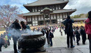 Crowded area with a large historic temple.