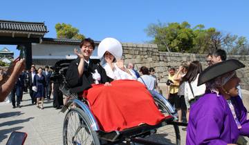 Traditional Japanese wedding procession with a rickshaw.