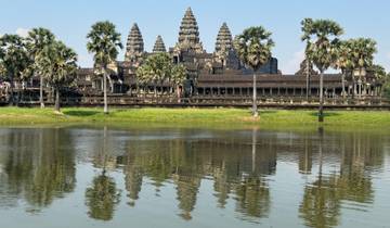 Angkor Wat temple with reflection in water.