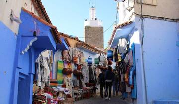 Market street in Chefchaouen with blue walls