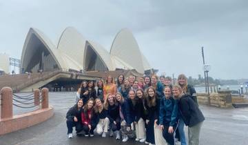 Group pose in front of the Sydney Opera House.