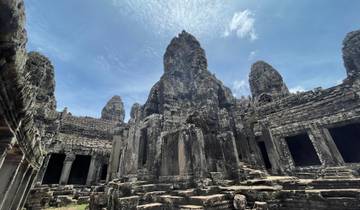 Large stone temple with cloudy sky.