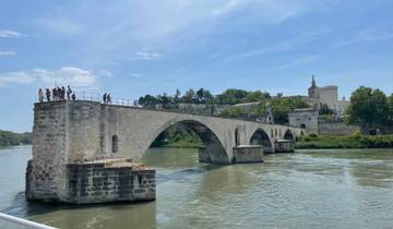 The Pont Saint-Bénézet bridge over the Rhone river with people.