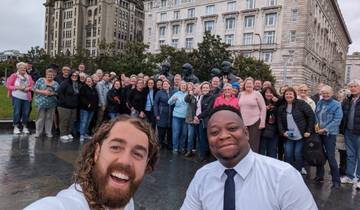 Group photo in front of iconic Liverpool buildings
