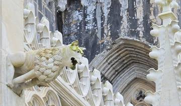 Architectural detail of a gargoyle on a historic building.