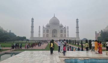 The Taj Mahal with tourists in the foreground.