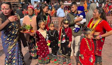Family dressed in colorful traditional attire at a cultural event.