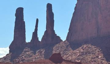 Dramatic rock formations in a desert landscape.