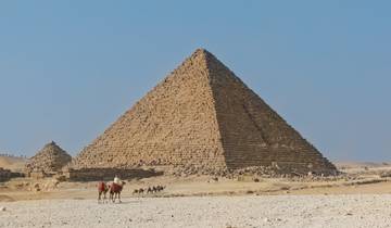 The Great Pyramid of Giza with camels in the foreground.