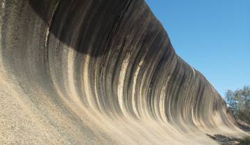 Wave Rock formation with a clear blue sky