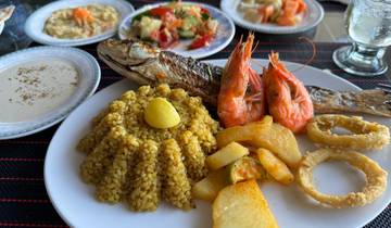 Plate of seafood with side dishes.